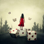 Girl in red dress with large dice