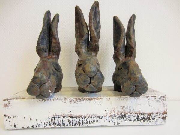 IMG_3231 Three ceramic hare's head mounted on wooden block