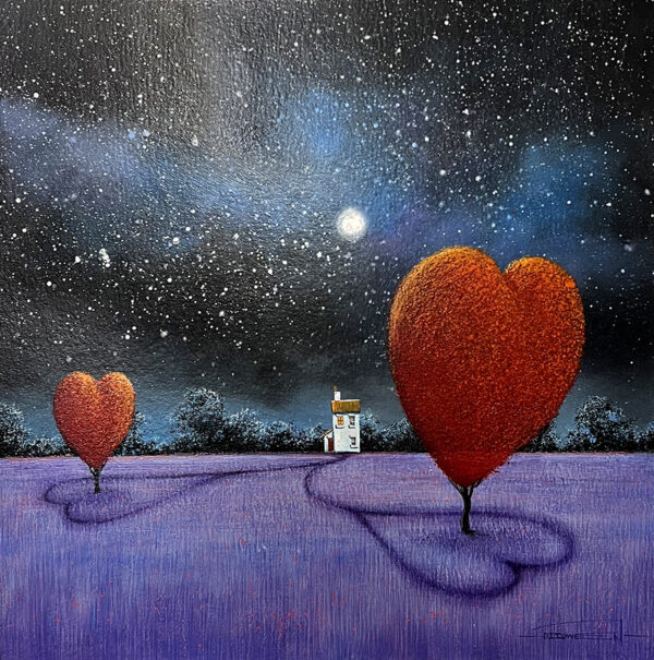 Red heart in the middle of a field of lilac