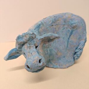 small blue ceramic cow